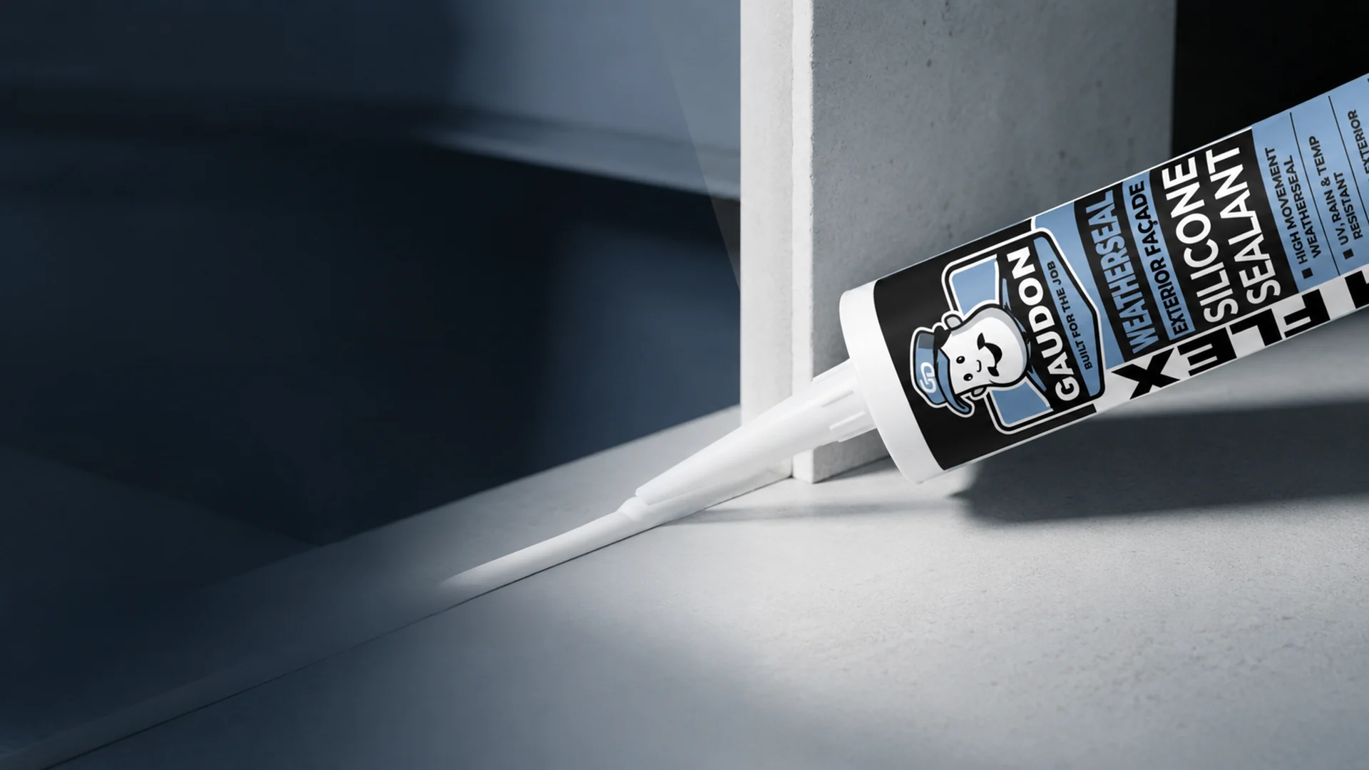 GAUDON Weatherseal exterior facade silicone sealant cartridge laying a white bead along a concrete corner joint